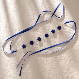 Elegant navy blue handmade floral headband with silk roses, pearls, and long satin ribbons