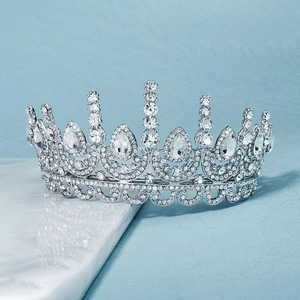 Macro detail of silver bridal tiara featuring teardrop crystals and alloy rhinestones