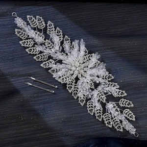 Detail of silver bridal hair vine with crystal leaves and rhinestones for weddings