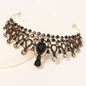 Vintage baroque wedding crown with black crystals on an antique gold metal base
