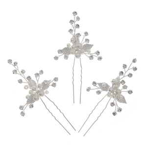 Three-piece bridal hair pins set with silver leaves, white pearls and sparkling rhinestones