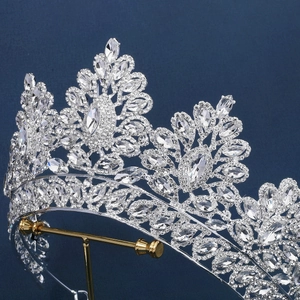 Macro side view of silver luxury wedding crown with detailed floral rhinestones and zircon