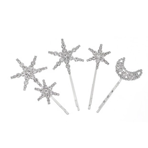 Detailed view of silver star and moon hair clips set with sparkling rhinestones