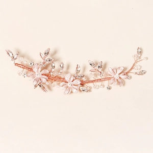 Luxurious rose gold bridal hairpiece with handmade alloy flowers, pearls and rhinestones