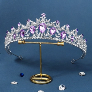 Detailed macro view of vintage bridal crown with purple teardrop crystals and alloy frame