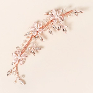 Luxurious rose gold bridal hair clip with handmade beads, rhinestone flowers and pearls