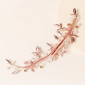 Elegant rose gold bridal hair clip with handmade pearls, crystals and metallic leaves