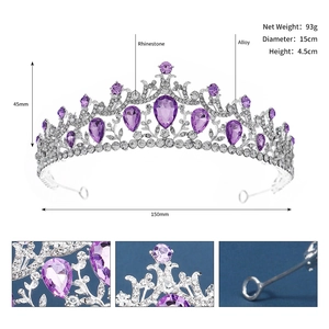 Close-up of vintage alloy bridal crown showing purple rhinestones and silver metal texture