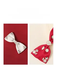 Detail of satin bow hair clips with hand-wired rhinestones and crystal decorations