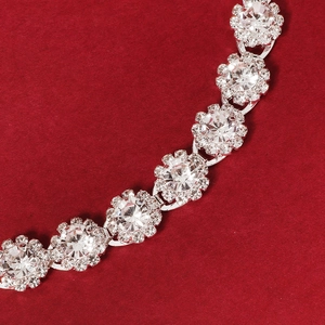 Macro view of luxurious floral rhinestone necklace featuring sparkling crystal clusters