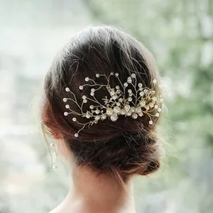 Detailed back view of a gold wire bridal hair comb with elegant pearls and crystals