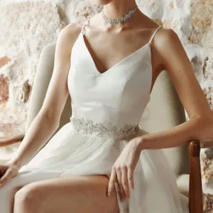 Close-up of bridal wedding belt featuring silver leaf design and sparkling rhinestones