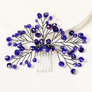 Elegant bridal hair comb featuring blue crystal branch design on a silver metal base