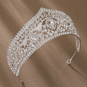 Close-up of luxury silver bridal tiara featuring teardrop rhinestones and baroque details
