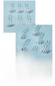 Macro detail of bridal star-shaped silver hair pins decorated with elegant white pearls