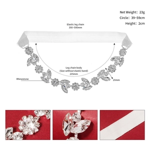 Detailed view of silver bridal leg garter with rhinestones, pearls and elastic band