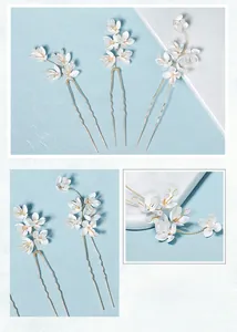 Détails des épingles à cheveux en U avec fleurs en acrylique blanc et étamines dorées