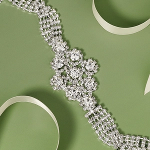 Luxurious silver bridal belt with sparkling rhinestones and floral geometric center