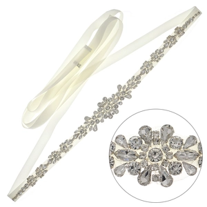 Exquisite bridal sash with ivory satin ribbon and floral rhinestone crystals on white background
