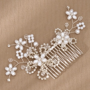Elegant silver flower hair comb with white pearls and crystals for bridal styling