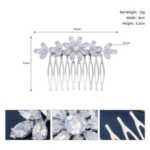 Macro view of bridal zircon hair comb featuring floral patterns and silver leaf details