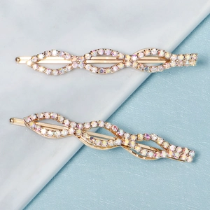 Elegantes Set aus zwei goldenen Haarklammern mit bunten Strasssteinen im Flecht-Design