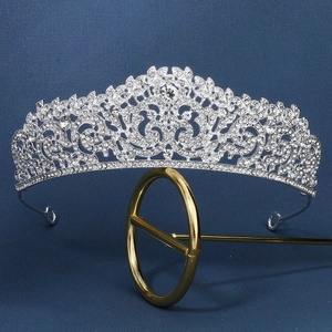 Close-up of vintage bridal crown with detailed silver alloy filigree and sparkling rhinestones