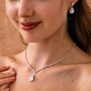 French vintage silver bridal jewelry set with water drop crystals on a female model