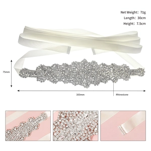 Luxurious bridal wedding dress sash with large floral rhinestone appliqué and white satin ribbon