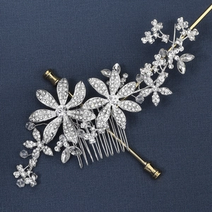 Macro detail of bridal flower hair comb featuring silver petals and shimmering rhinestones