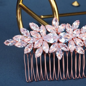 Detailed close-up of rose gold bridal hair comb with marquise and teardrop cubic zirconia