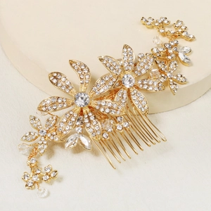 Macro detail of gold flower hair comb with shimmering crystals and sparkling rhinestones