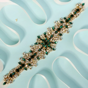 Detail of emerald and white crystal bridal belt with marquise rhinestones on ribbon