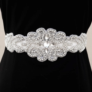 Exquisite handmade bridal belt with shimmering rhinestones and beads on black fabric