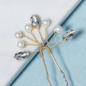 Elegant bridal gold hair pin with white pearls and marquise crystals in a U-shape design