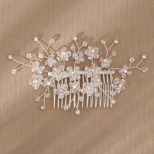 Handmade silver bridal hair comb with crystal flowers for elegant wedding hairstyles