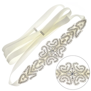 Elegant ivory satin bridal belt with handcrafted crystal and rhinestone floral patterns