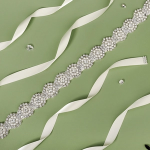 Elegant bridal sash with sunflower rhinestones and pearls on white satin ribbon