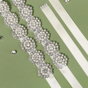 Elegant bridal sash belt featuring luxury rhinestones and white pearls on satin ribbon