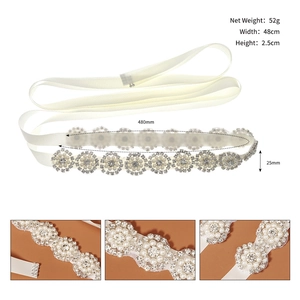 Detailed view of pearl and rhinestone wedding belt with dimensions 48cm by 2.5cm