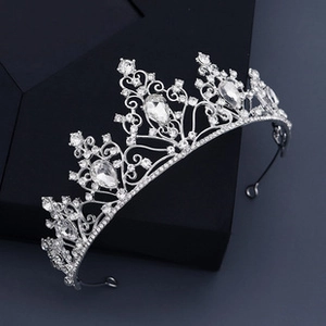 Detailed macro view of silver floral crown with sparkling rhinestones and crystal teardrops