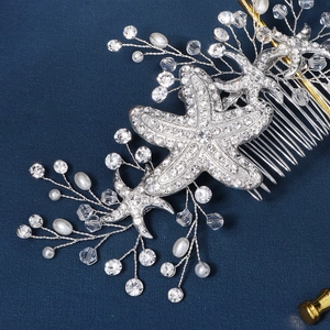 Starfish bridal hair comb with crystals and pearls on elegant dark blue background