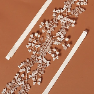 Macro shot of handcrafted bridal headband with white pearls and clear crystal beads