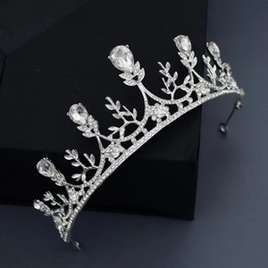 Detail view of silver baroque crown with teardrop rhinestones on black display box