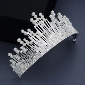 Detailed macro view of silver tiara with white pearls and sparkling rhinestones