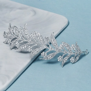 Elegant silver bridal headband with crystal leaf vine design and shimmering rhinestones