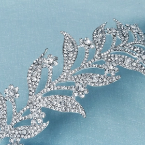 Elegant silver tiara with rhinestones and floral leaf design for bridal hair styling