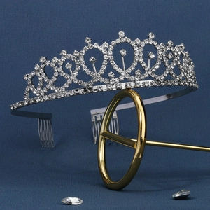 Detailed shot of silver bridal crown with clear rhinestones and integrated hair combs