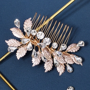 Detailed close-up of rose gold leaf hair comb with sparkling crystal rhinestones
