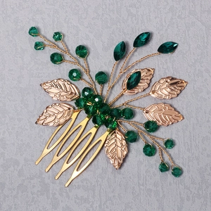 Vintage gold hair comb with green crystals and handmade metal leaves for bridal styling